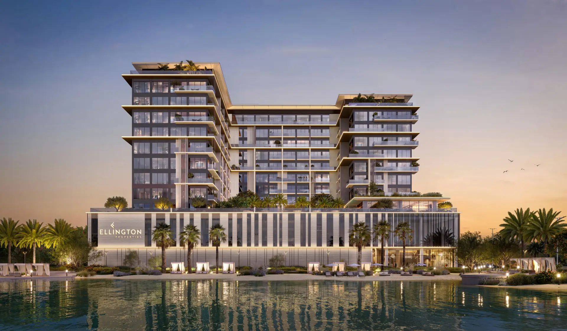 Boutique apartment building beside a lagoon at dusk